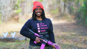 woman holding firearm