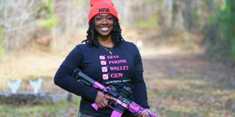 woman holding firearm